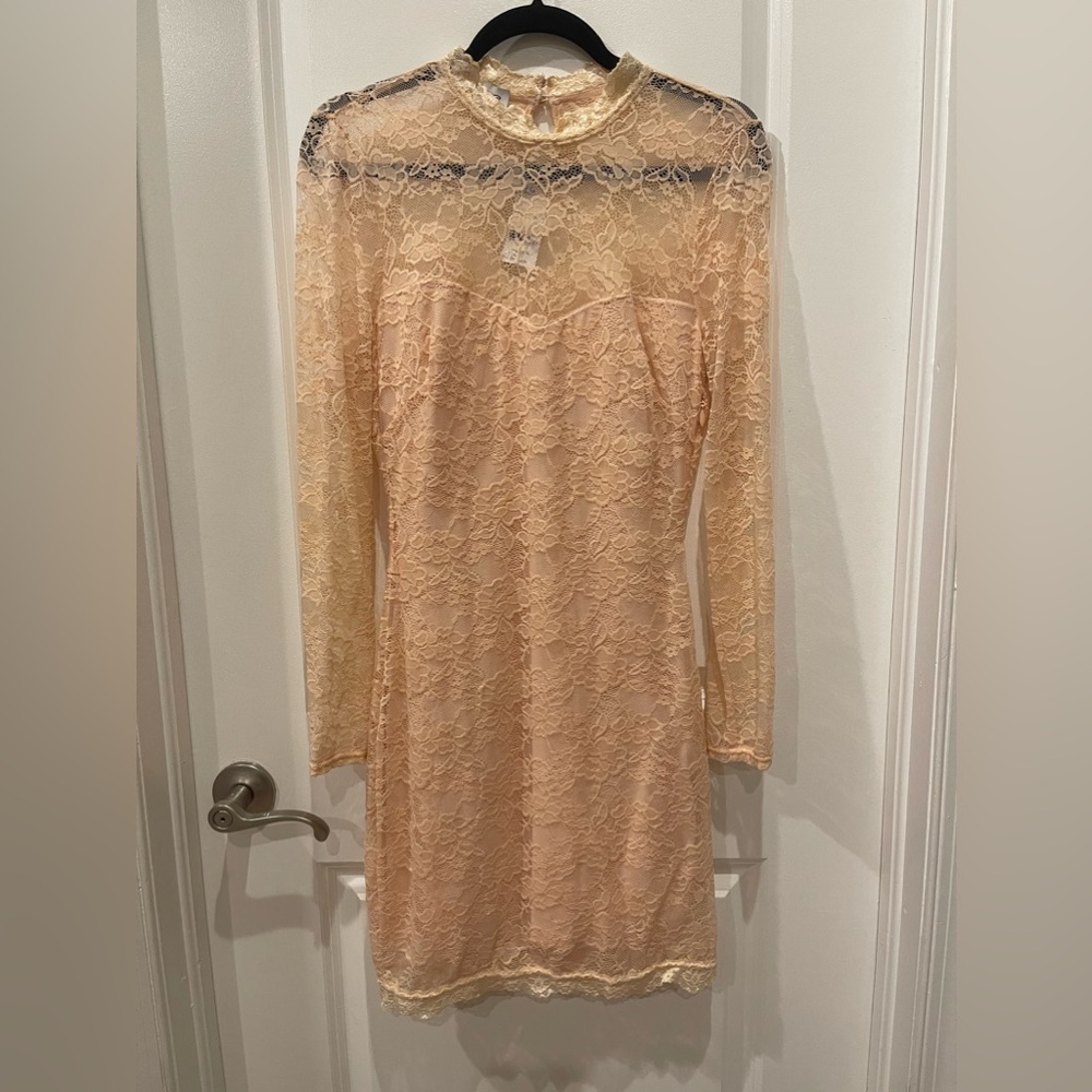 Lace long sleeve mini dress by Bebe